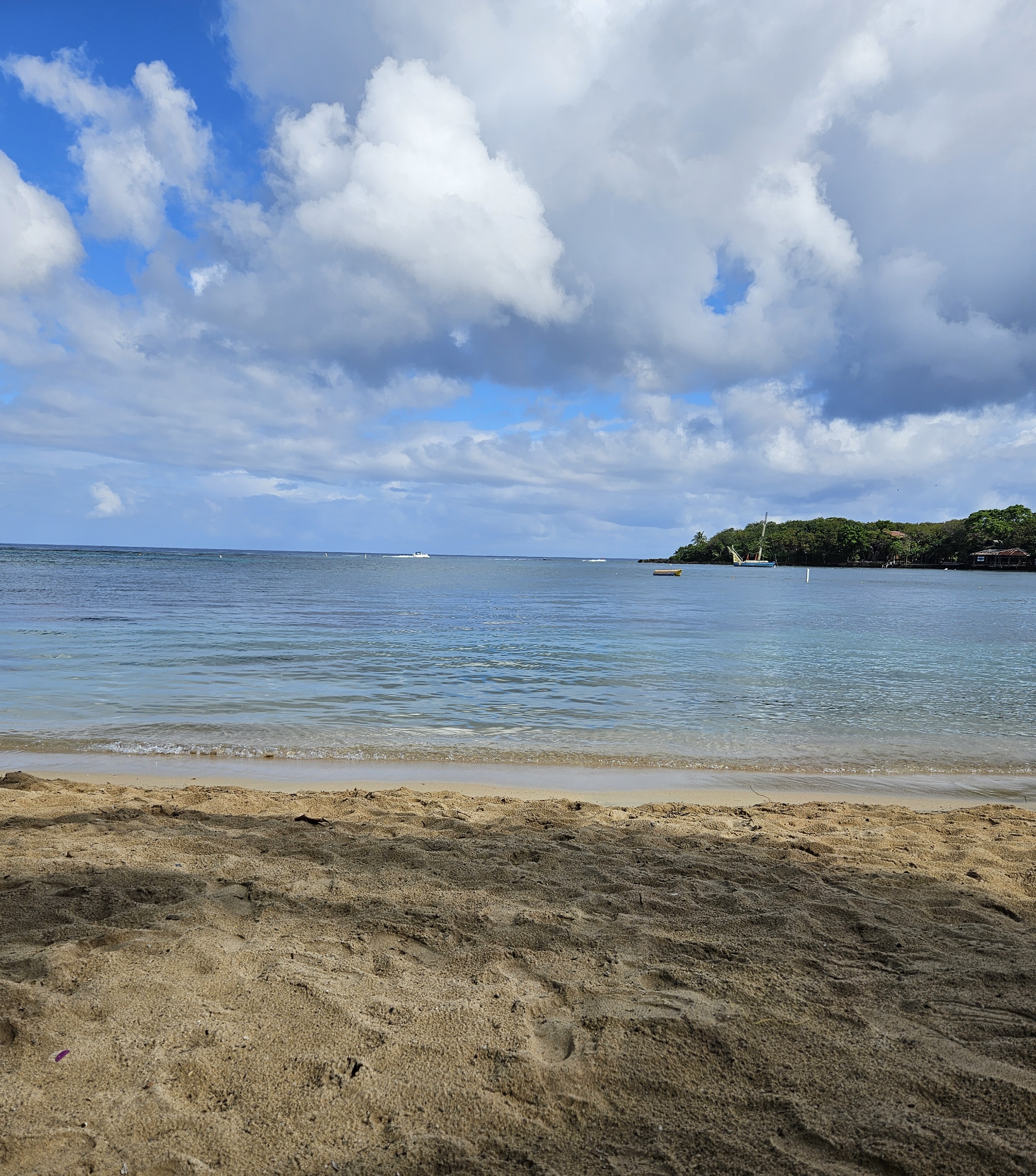Half Moon Bay beach and calm Caribbean water in West End Roatan